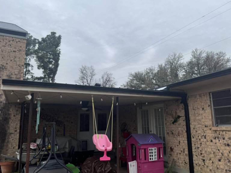 commercial-gutter-maintenance-backyard-with-playset-and-swing