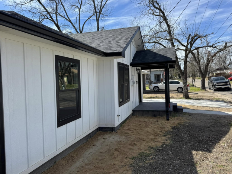 commercial-gutter-maintenance-house-exterior-with-roof-and-trees