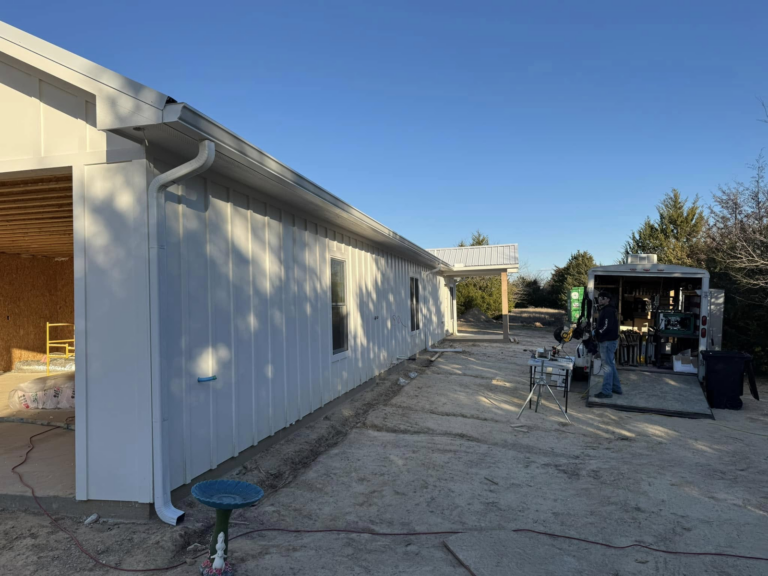 firefighter-owned-gutter-company-building-installation-site