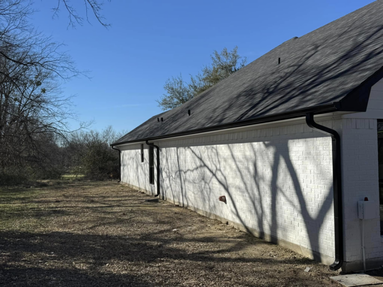 firefighter-owned-gutter-company-on-white-brick-house-exterior