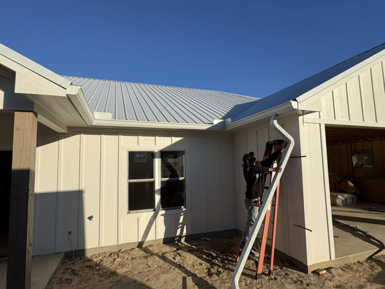gutter-repair-on-home-roof-with-worker-and-ladder-2023