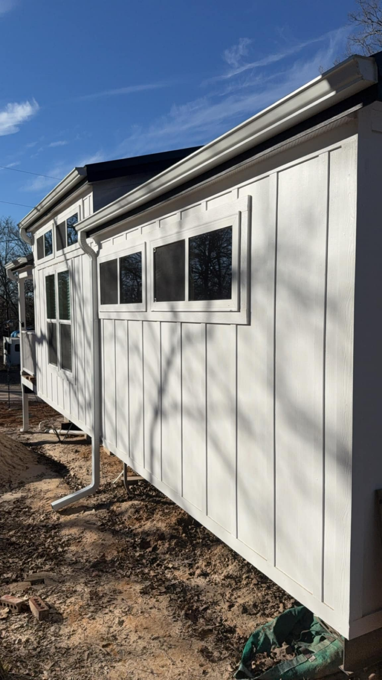 new-white-house-wall-with-rain-gutter-replacement-installation